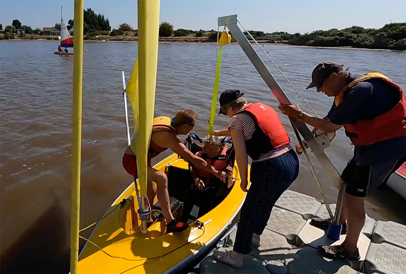 Snettisham Beach SC Sailability hoisting into a Hansa 303