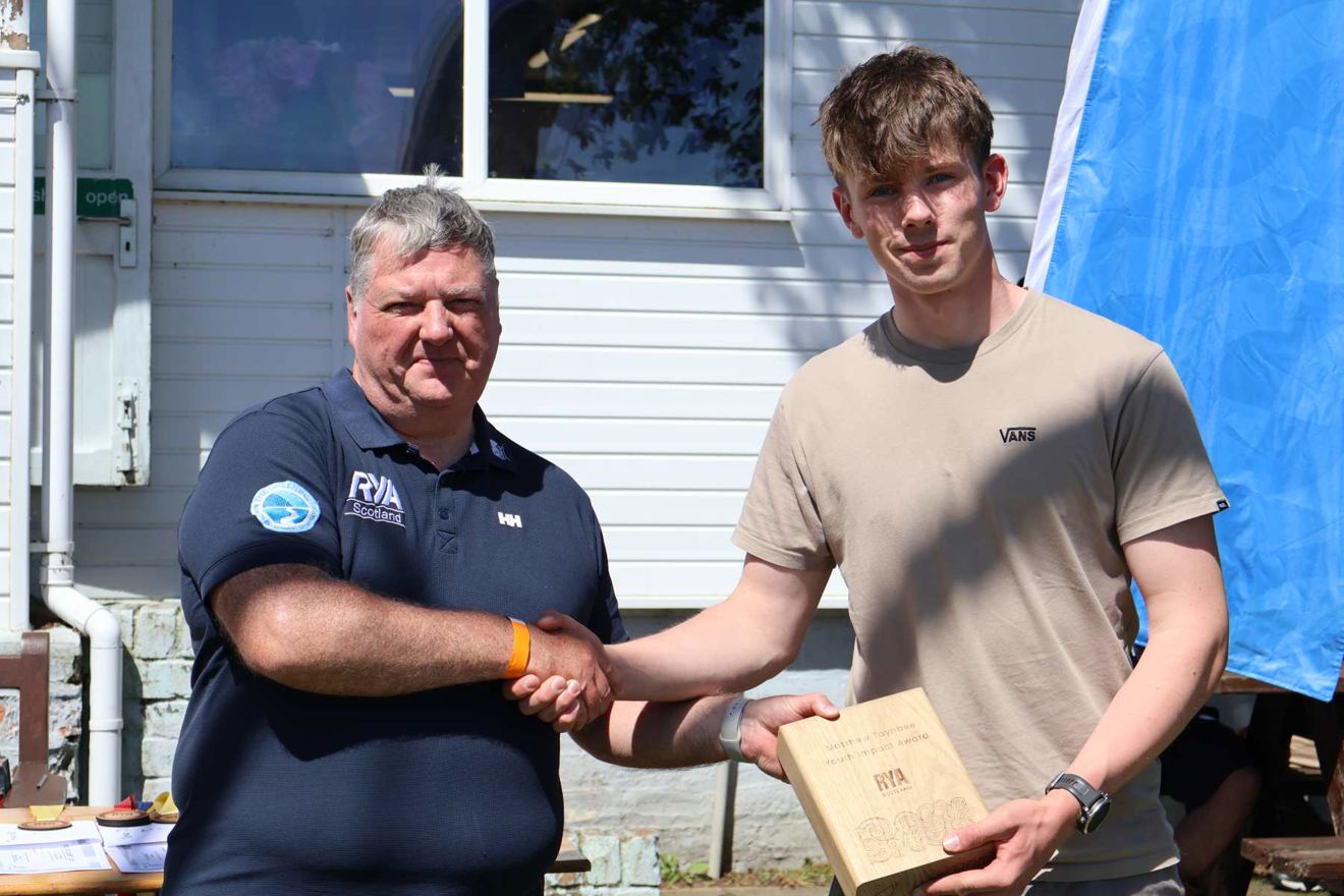 RYA Scotland Chair Brian Wilson presenting Cameron McDaid with the Matthew Toynbee Youth Impact Award