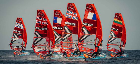 Long shot of iQFOiL windsurfing foil boards on water