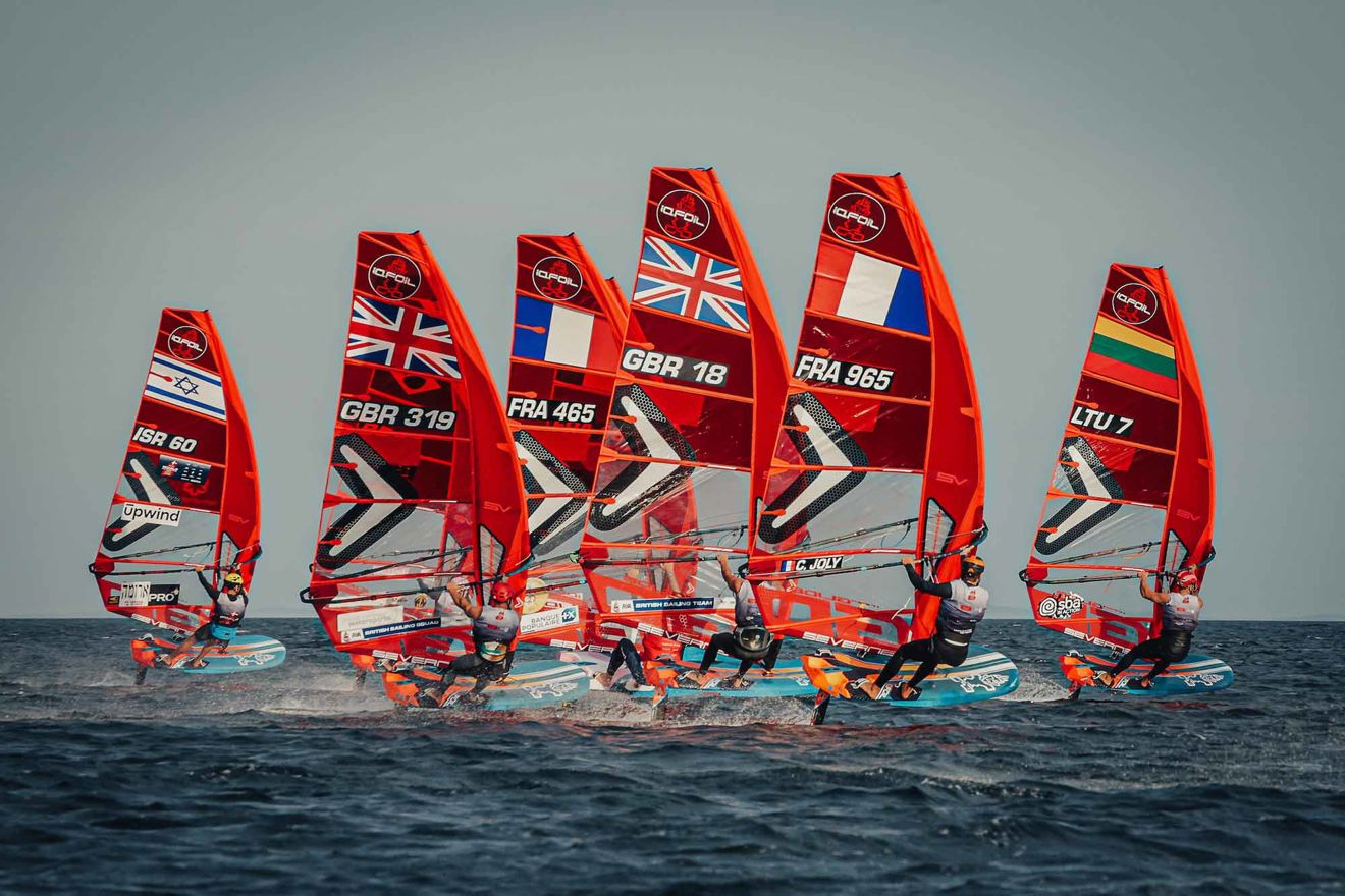 Long shot of iQFOiL windsurfing foil boards on water