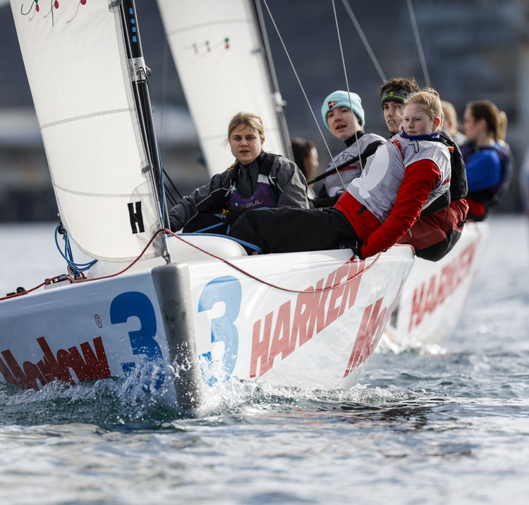 young people sailing on a dinghy 