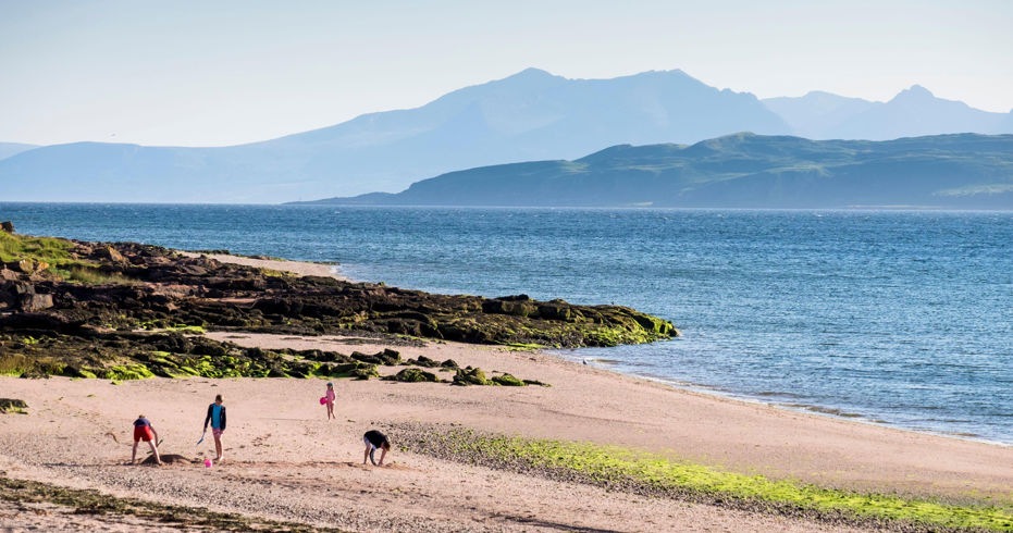 family walking along beach