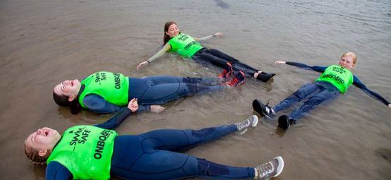Children practicing the swim safe pose