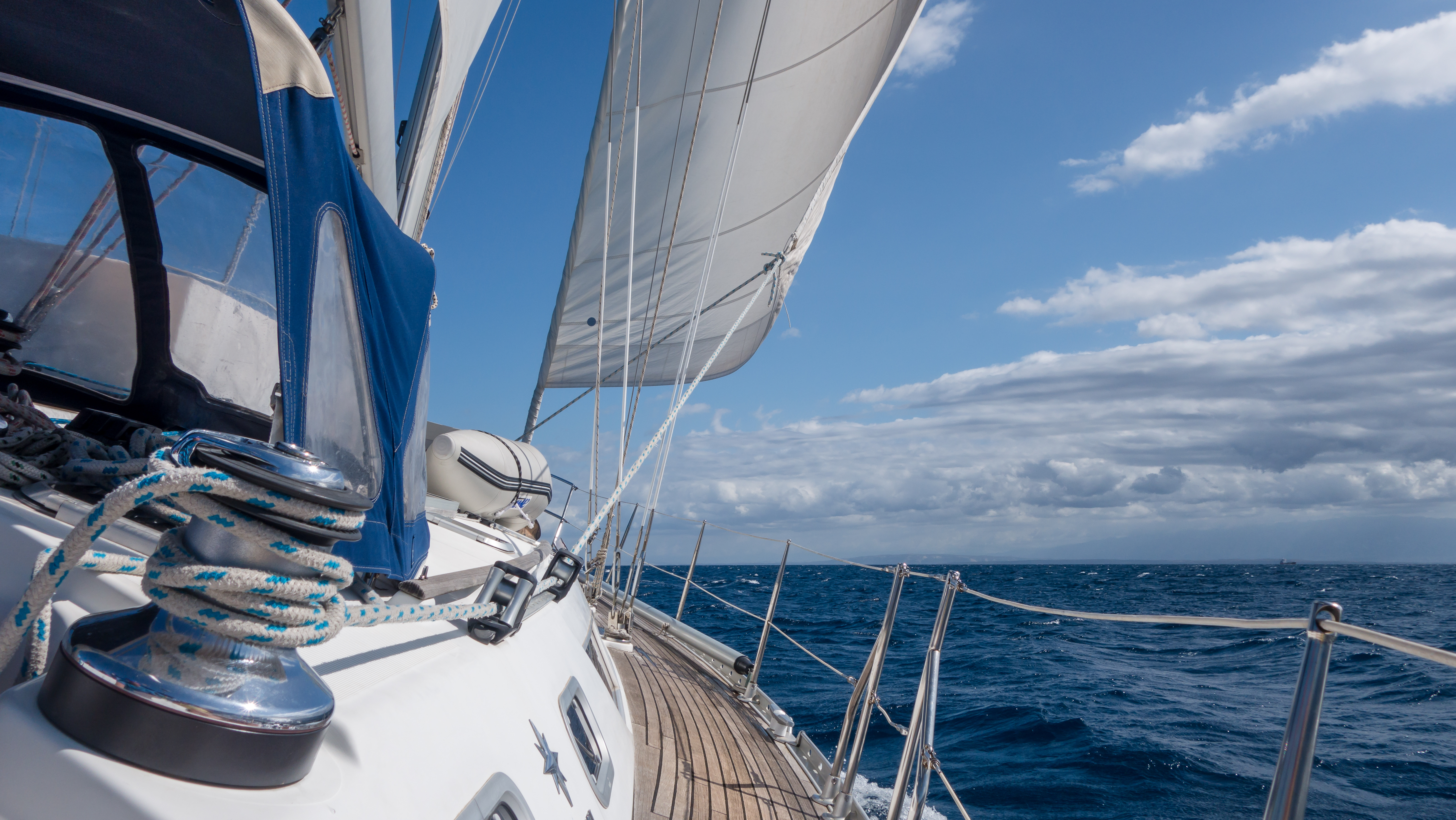 An image of wide shot of boat sailing through the water