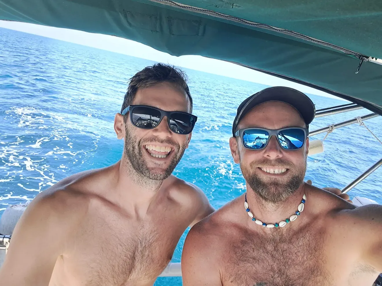 Tom and Peter on the bow of their boat