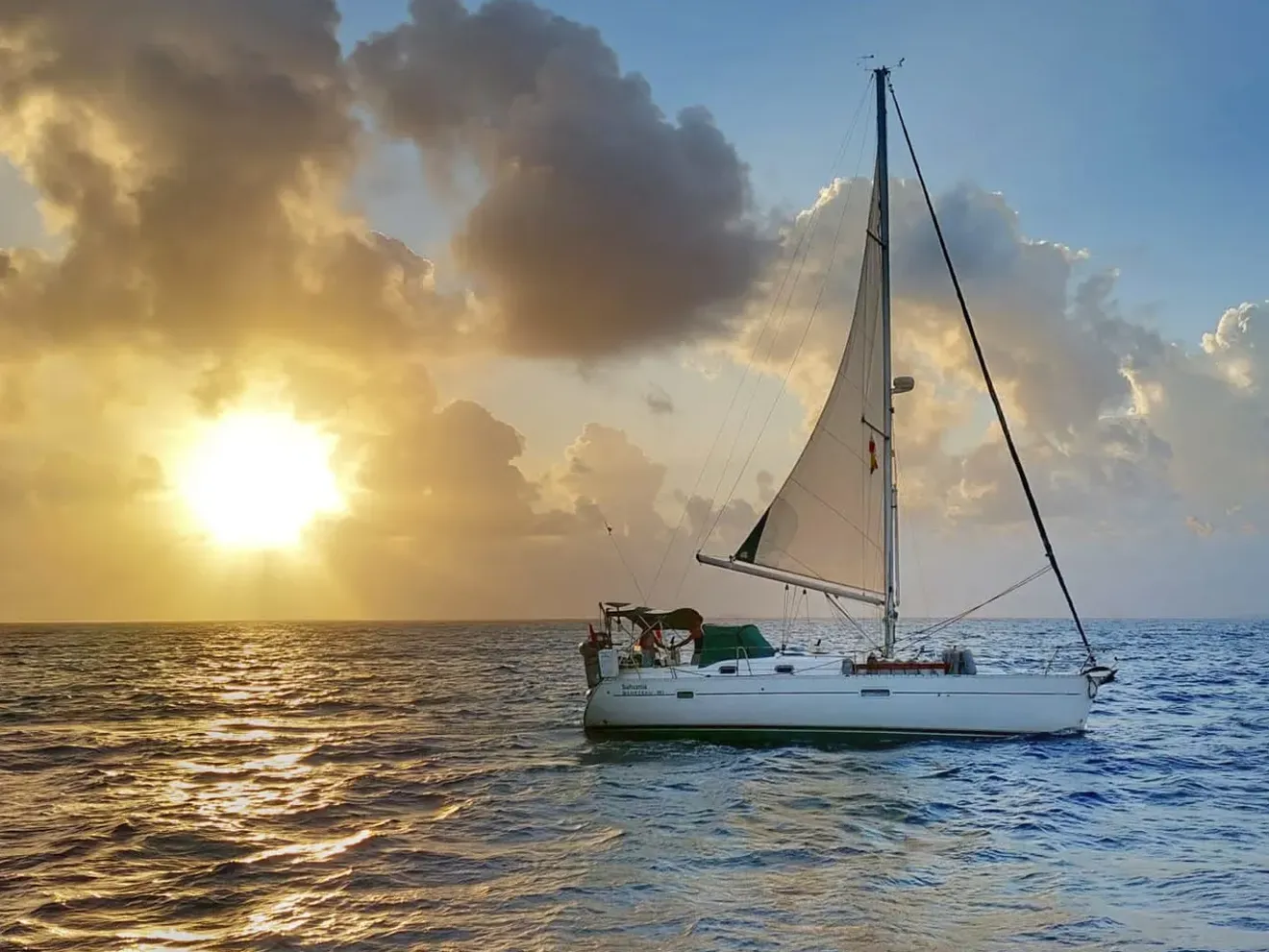 Wide shot of Yacht at sunset 