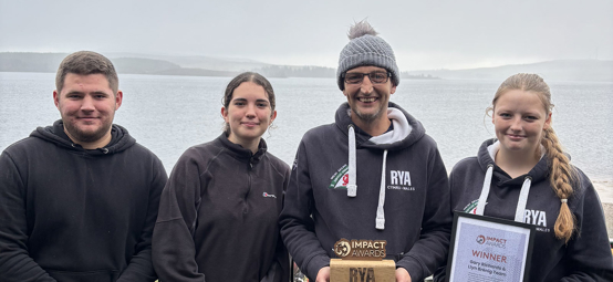 Training team representatives receiving their Impact Award at Llyn Brenig SC - left to right - Ryan Hill, Sophie Hill, Gary Richards (Chief Instructor) and Torie Richards. 