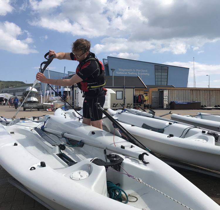 Man cleaning pico boat 