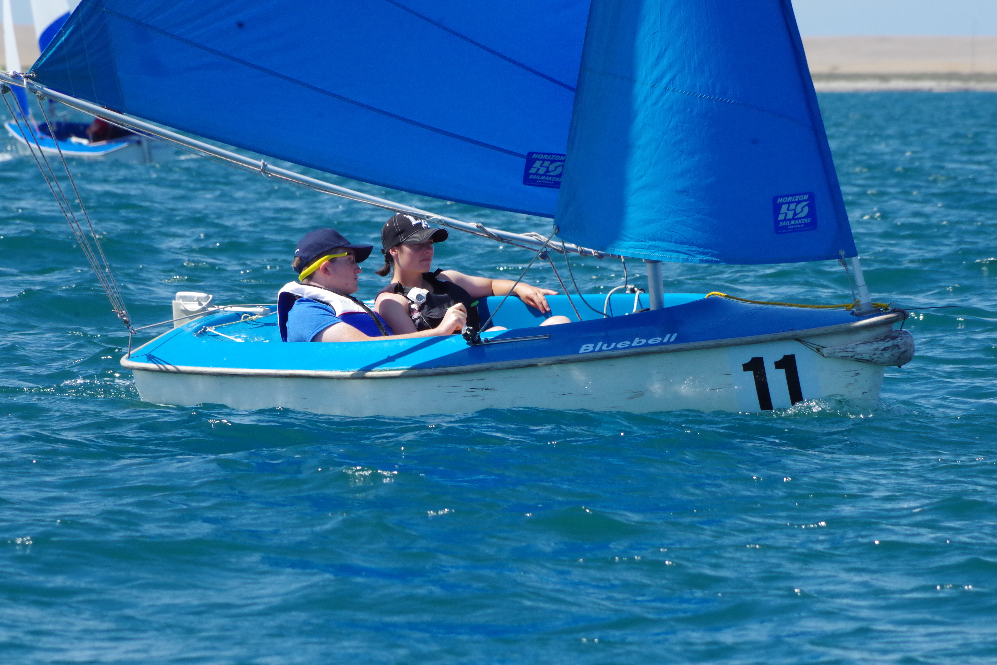 Joe sailing in a dinghy on the ocean