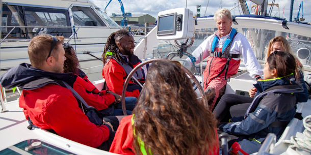 Instructor teaching pupils onboard