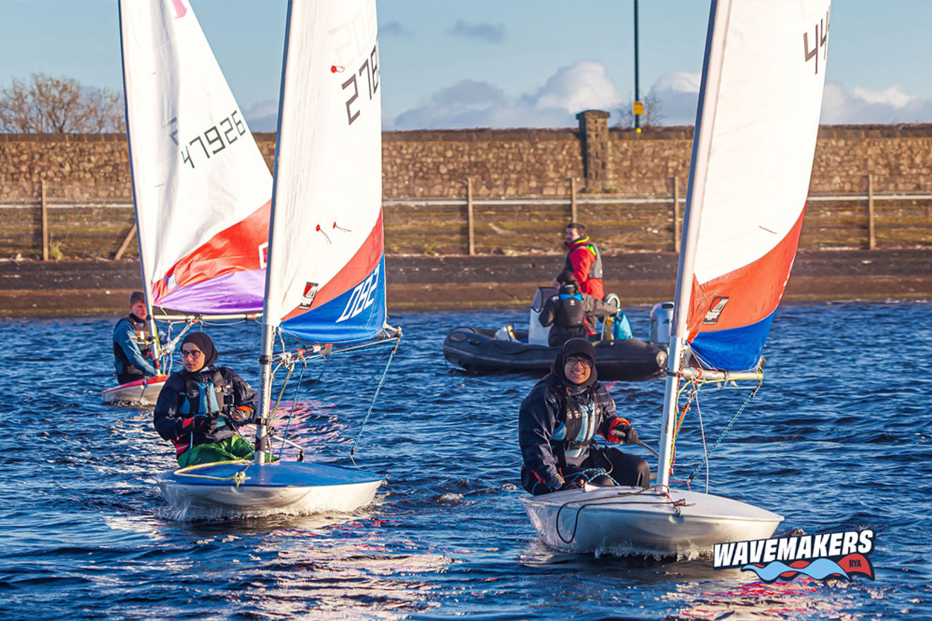 Group of young sailors training on the water