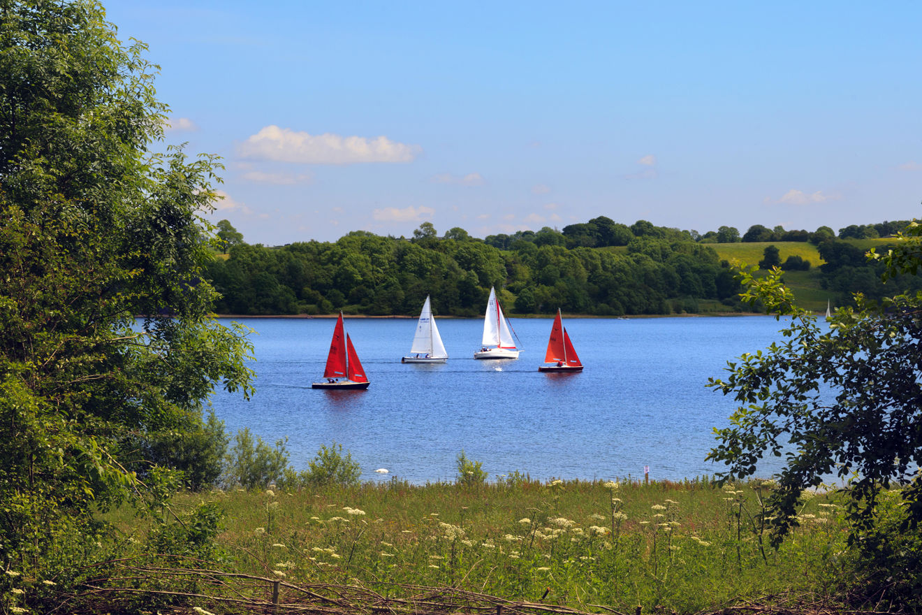Four dinghies on a lake at Carsington