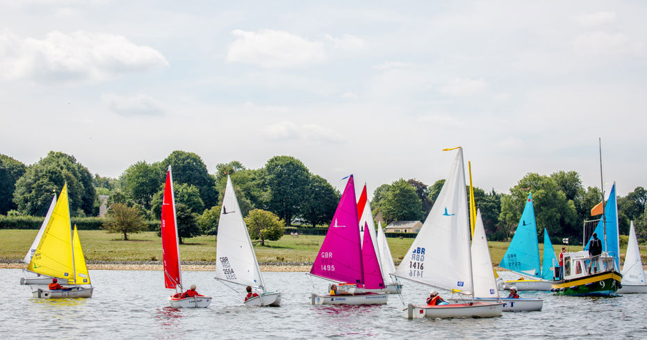 fleet of dinghies sailing on a lake