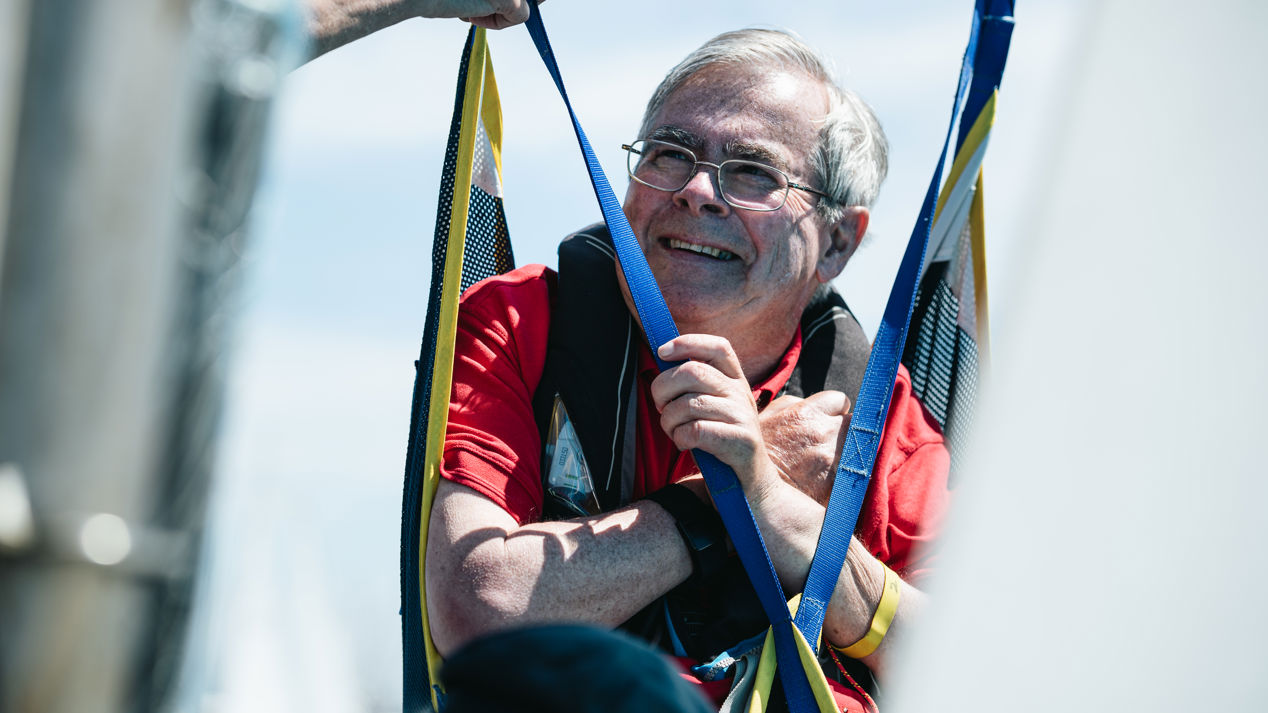 Disabled sailor Chris Emmet smiling on a boat
