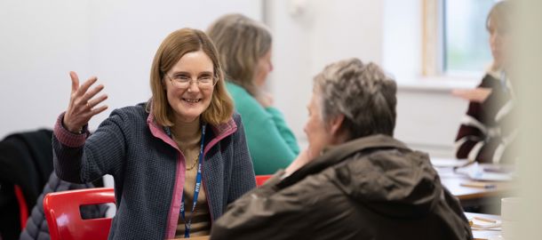 Mid shot of two Connected Conference attendees engaging in conversation