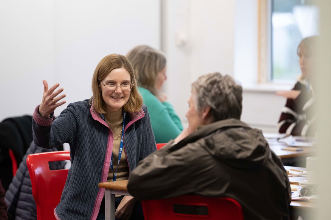 Mid shot of two Connected Conference attendees engaging in conversation