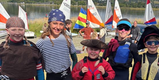Five young sailors dressed as pirates on shore at Bala Sailing Club at the 2026 Welsh Sailing OnBoard Festival.