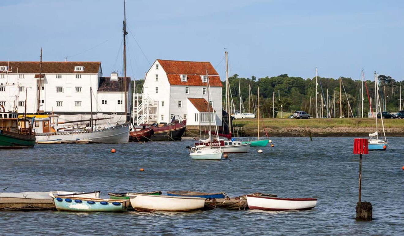 AN image of Wide shot of dinghies mooring