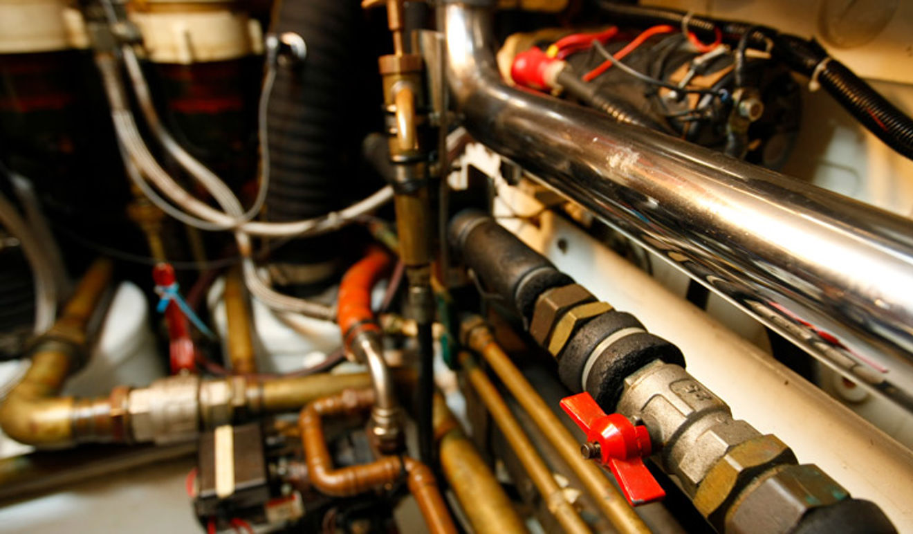 Pipes and mechanisms within a boat engine 