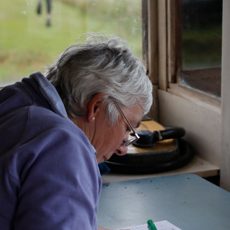 Over the shoulder shot of volunteer completing paperwork