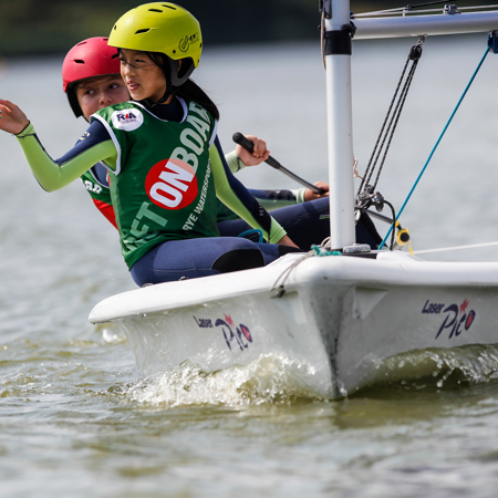 Two young sailors in a dinghy