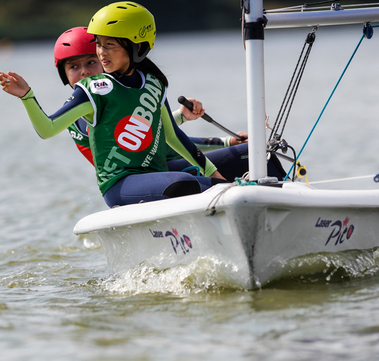 Two young sailors in a dinghy