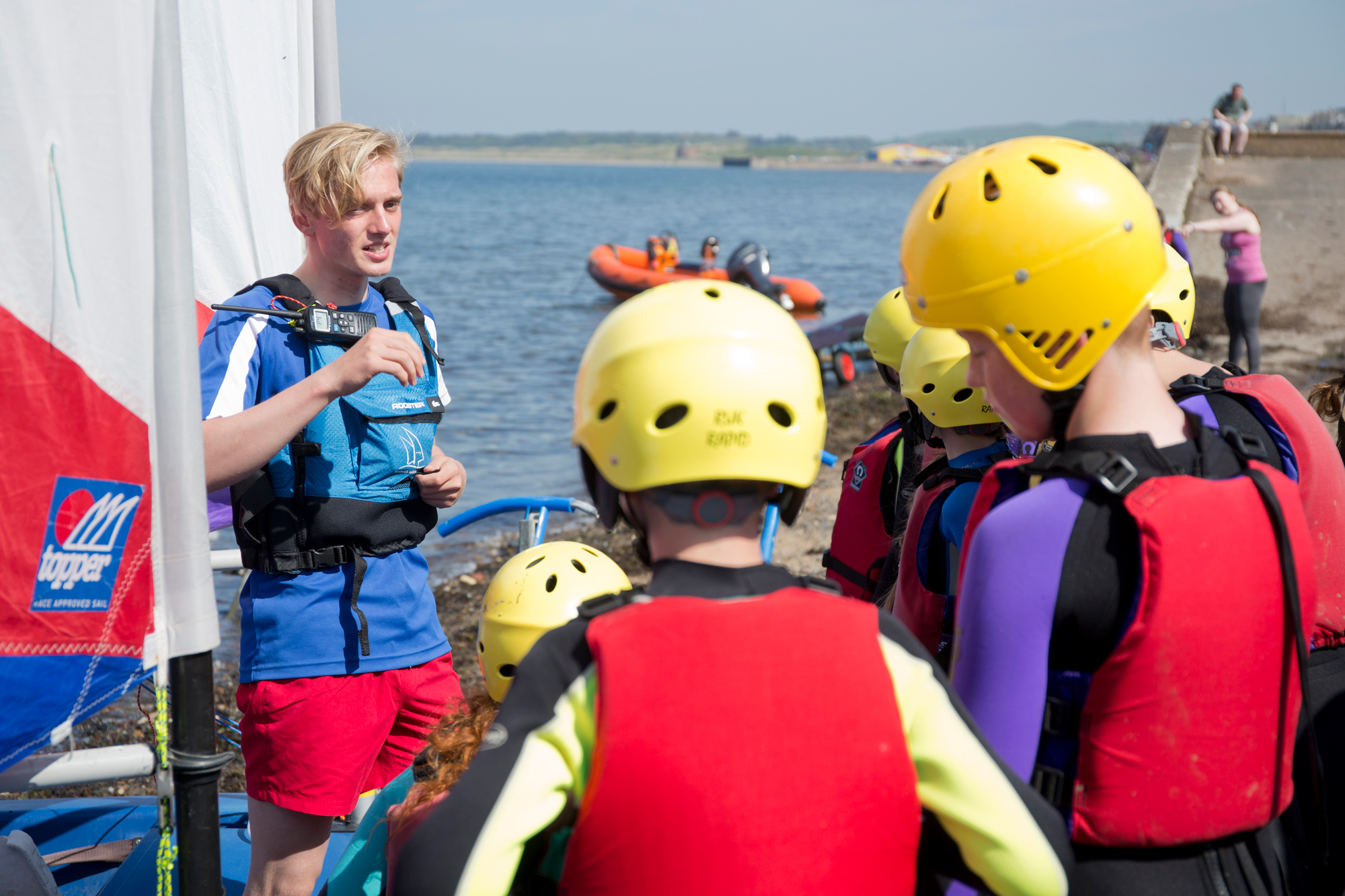 Children listening to instructions from volunteer