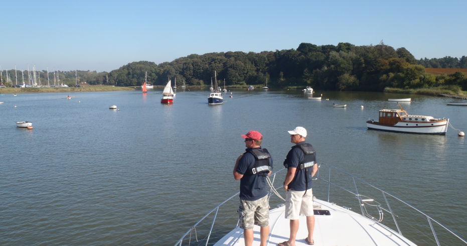 two men on a powerboat at Woodbridge harbour