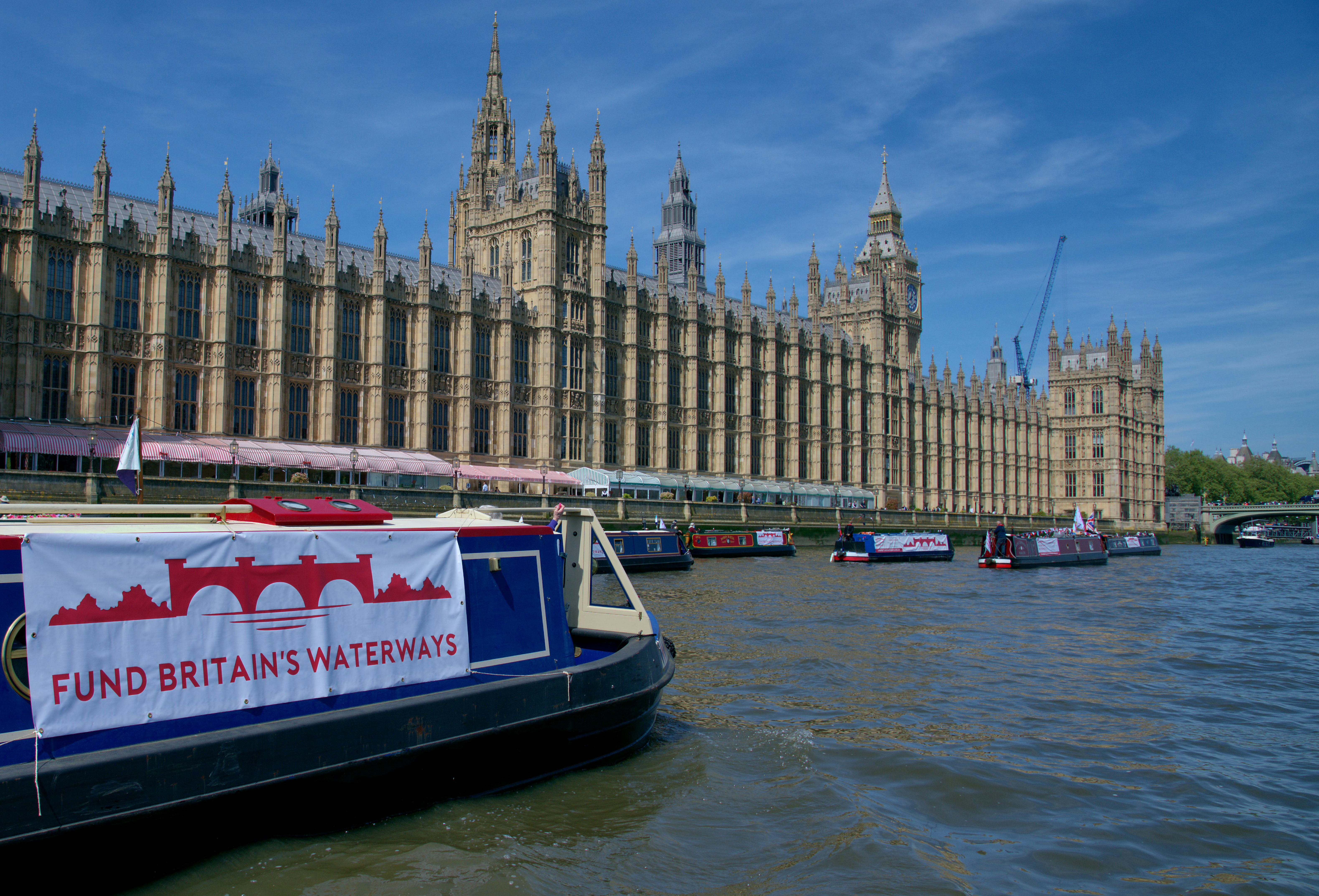 A narrowboat outside the Houses of Parliament