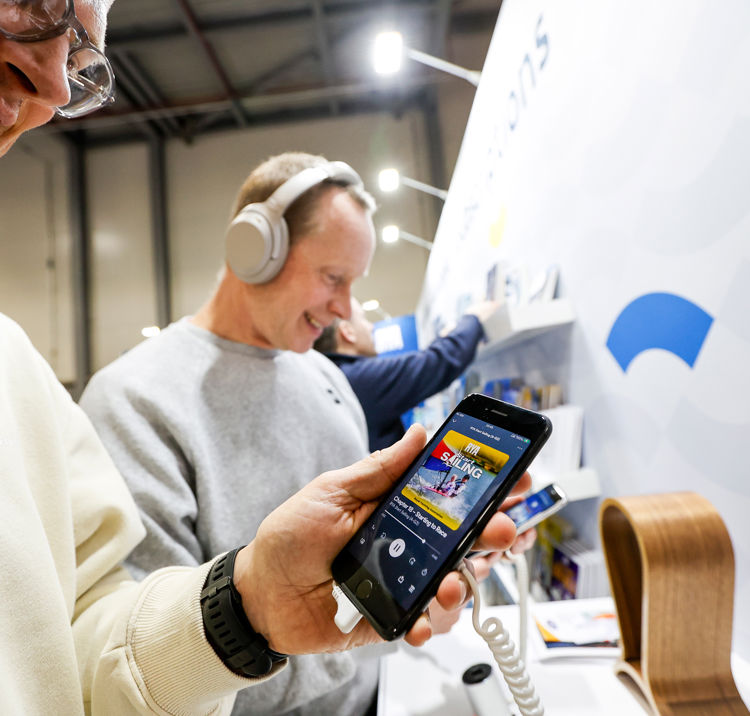 Mid shot of person using RYA shop on their mobile