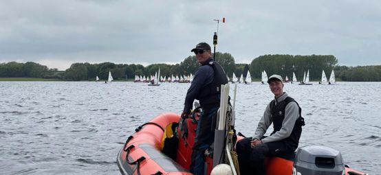 Welsh Sailing volunteers Russell and Thomas Venning providing mark laying and on water support from a powerboat at the Eric Twiname Junior Championships 2026. 