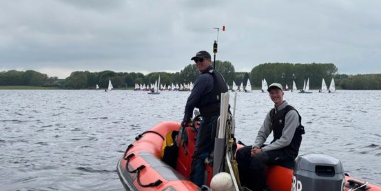 Welsh Sailing volunteers Russell and Thomas Venning providing mark laying and on water support from a powerboat at the Eric Twiname Junior Championships 2026. 