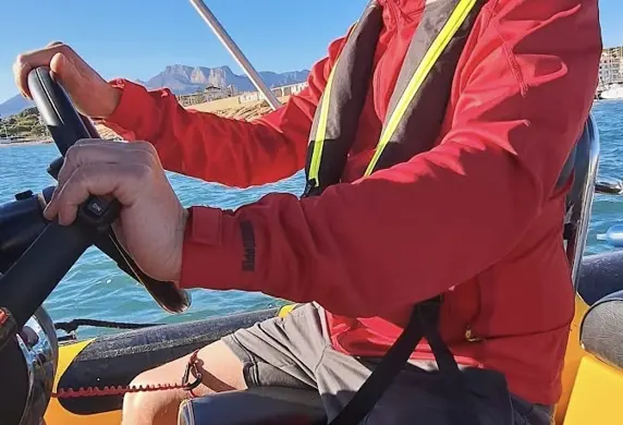 A man driving a powrboat