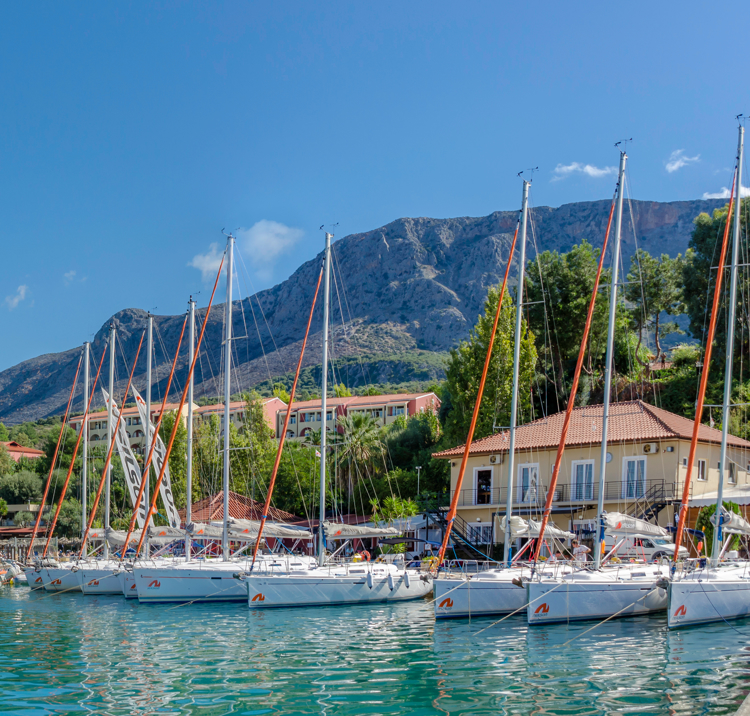 row of sailing yachts at a harbour