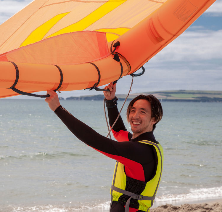mid shot of windsurfer demonstrating the use of their wing