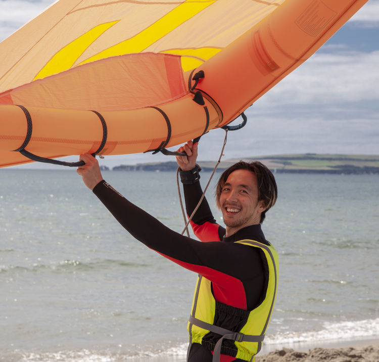mid shot of windsurfer demonstrating the use of their wing