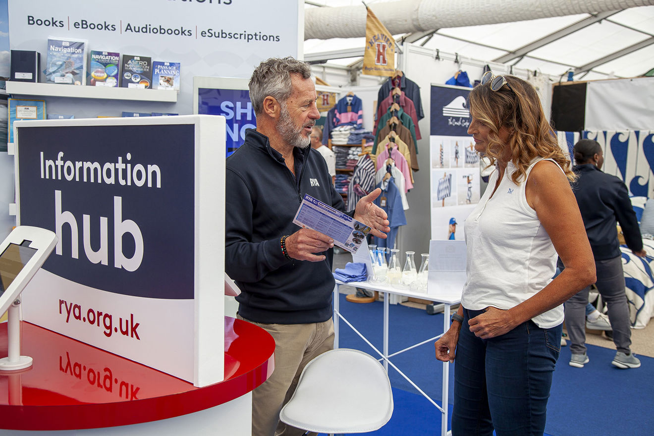 RYA at the Southampton International Boat Show - RYA colleague speaking to a show visitor