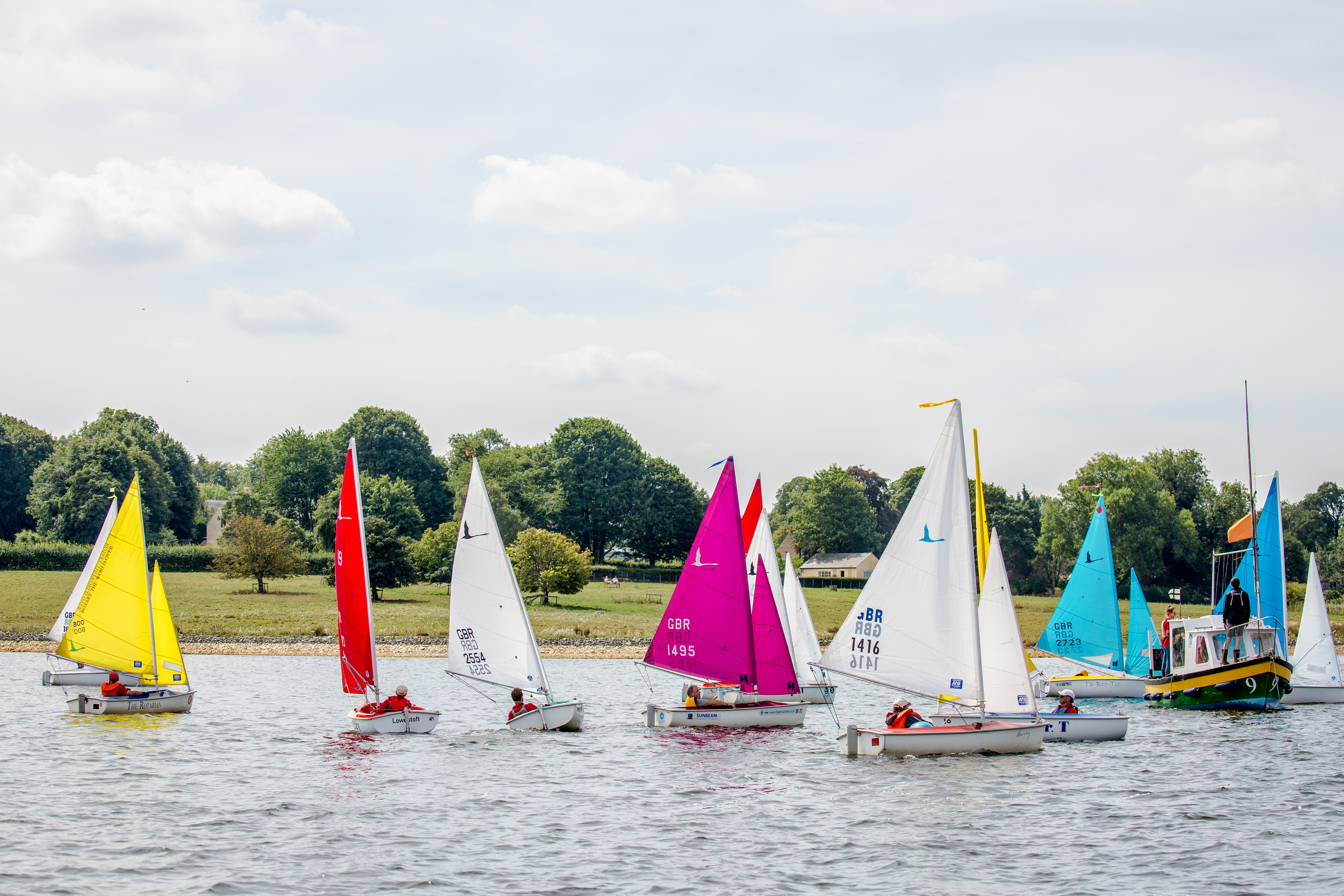 Group of dinghies sailing on a lake