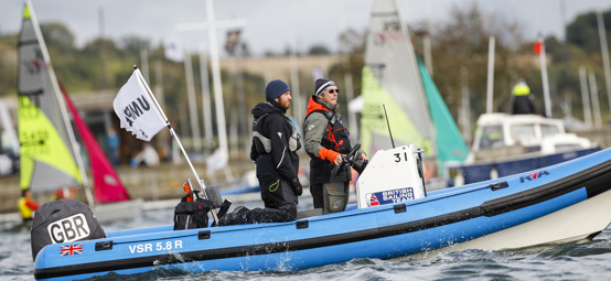 two race officials on a powerboat