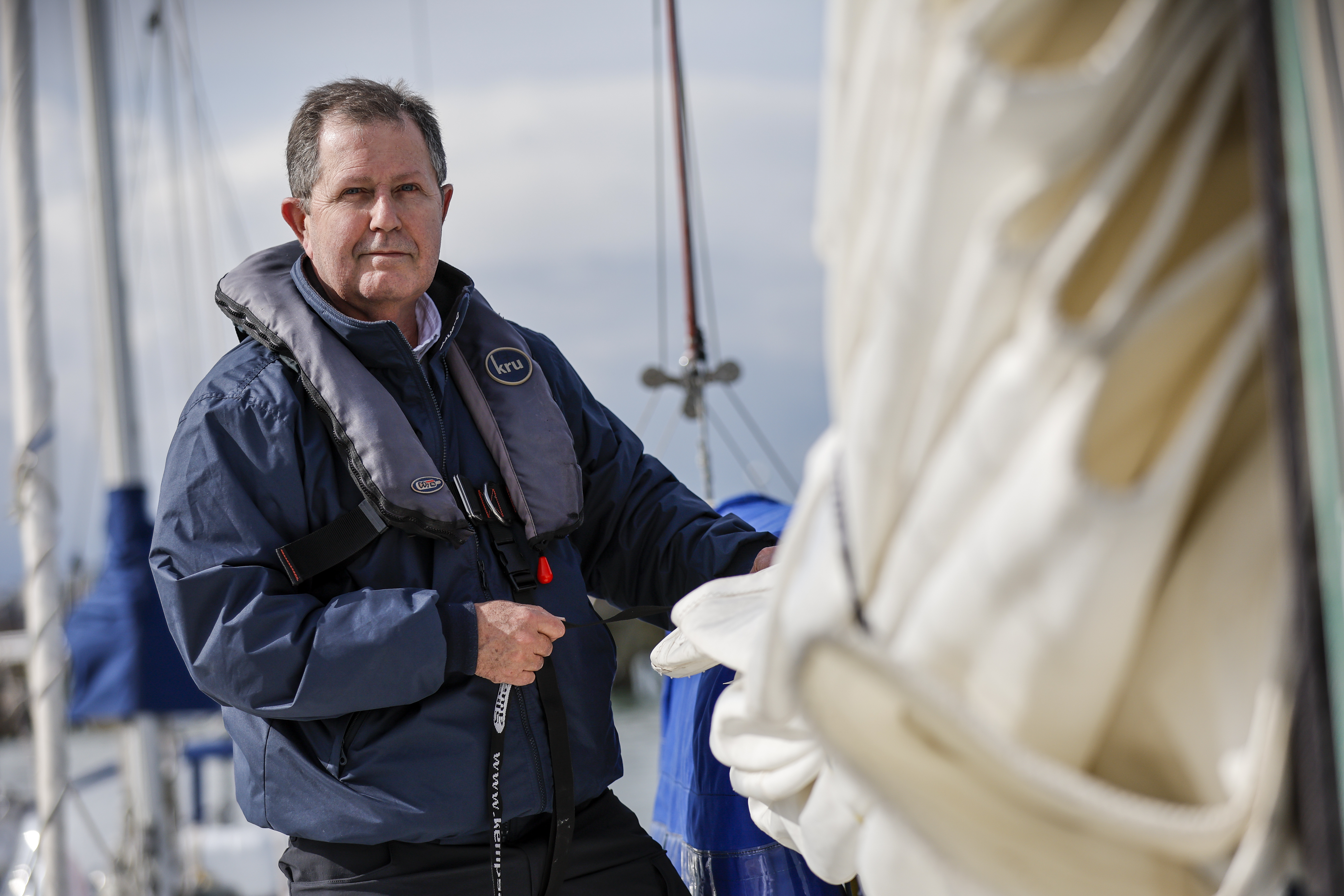 Shot of Ed adjusting the sails on his boat