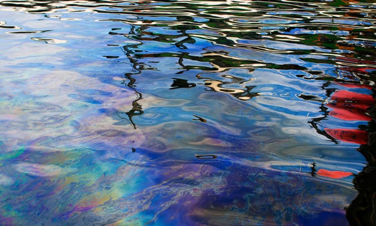Oil and fuel leakage on the water