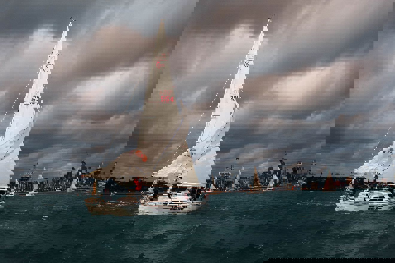 yacht sailing safely through murky weather