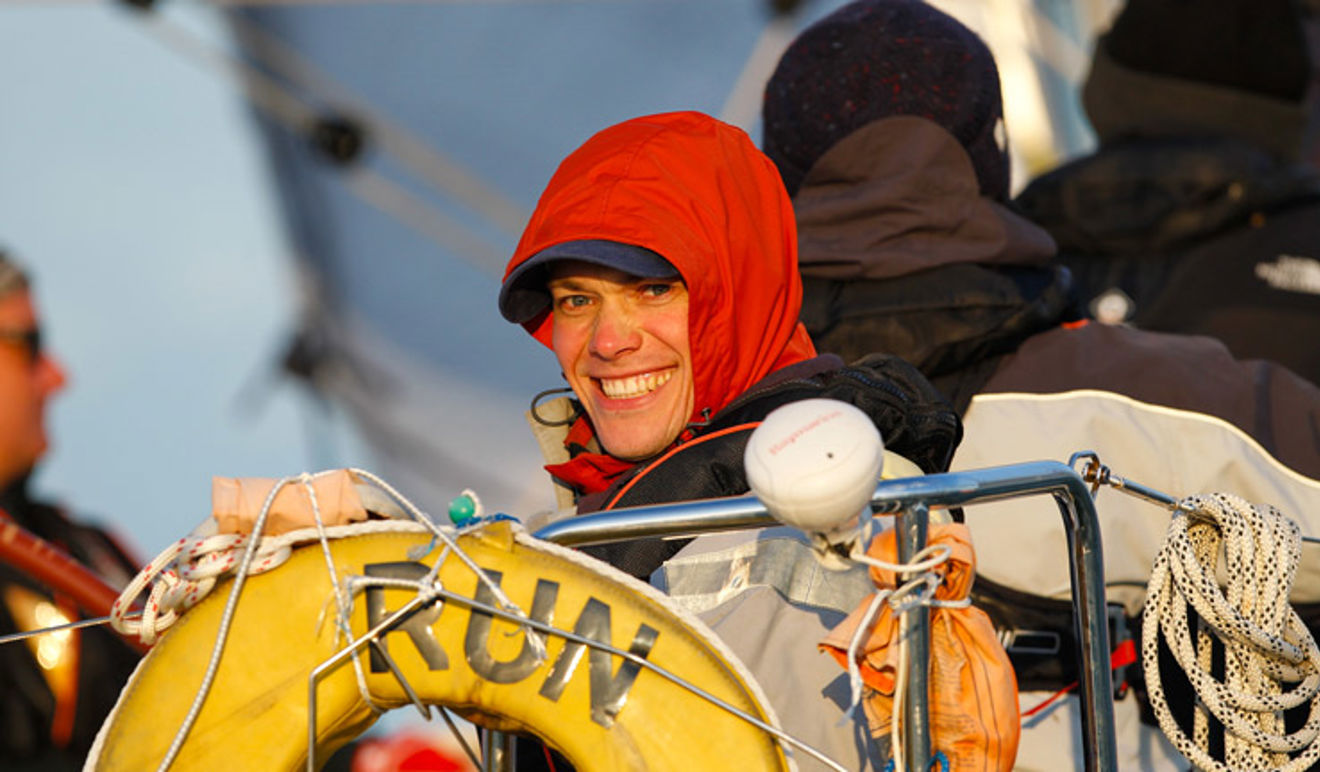 Mid shot of woman turning and smiling at camera