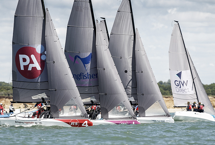 close keelboat racing along coastal course