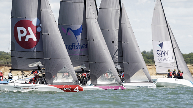 close keelboat racing along coastal course