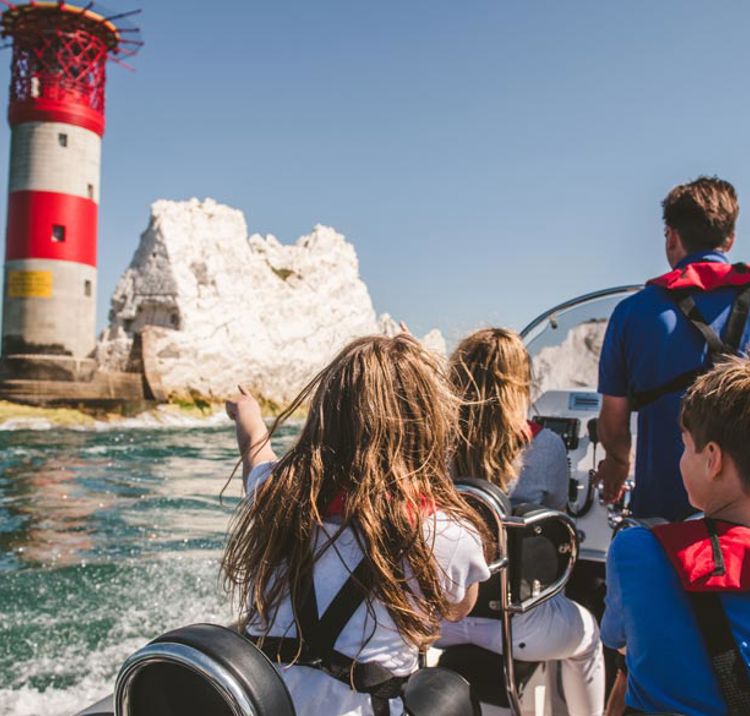 Young sailors on a powerboat with instructor