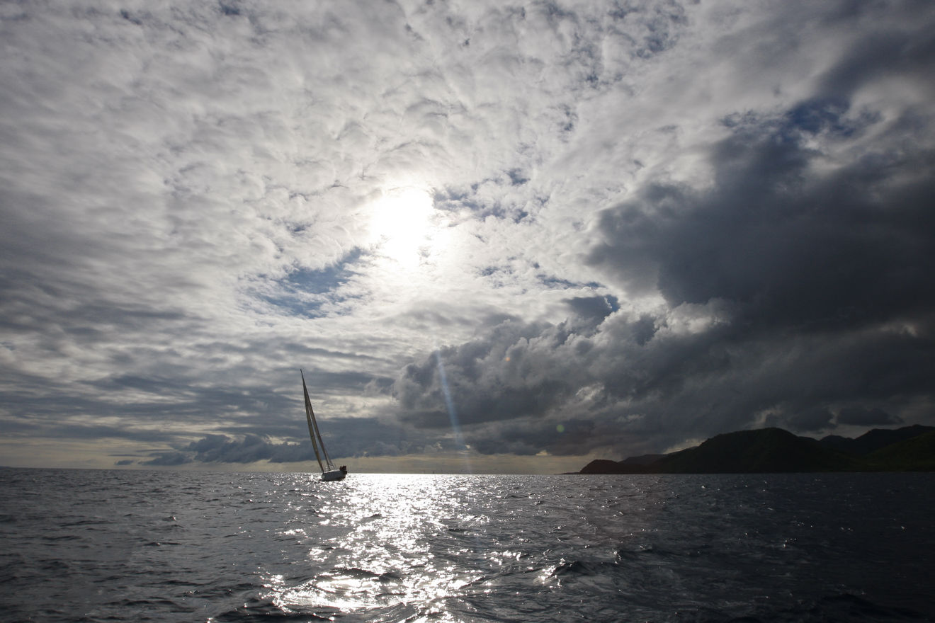 Sailing yacht in winter across cold water