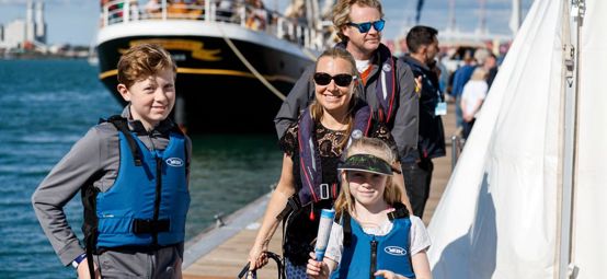 Family walking to boat at Southampton Boat Show