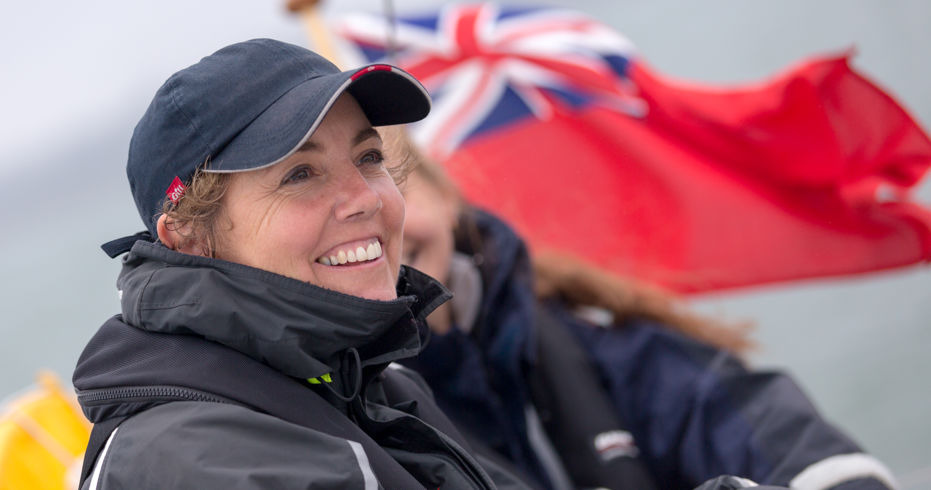 close up of lady smiling whilst on a boat