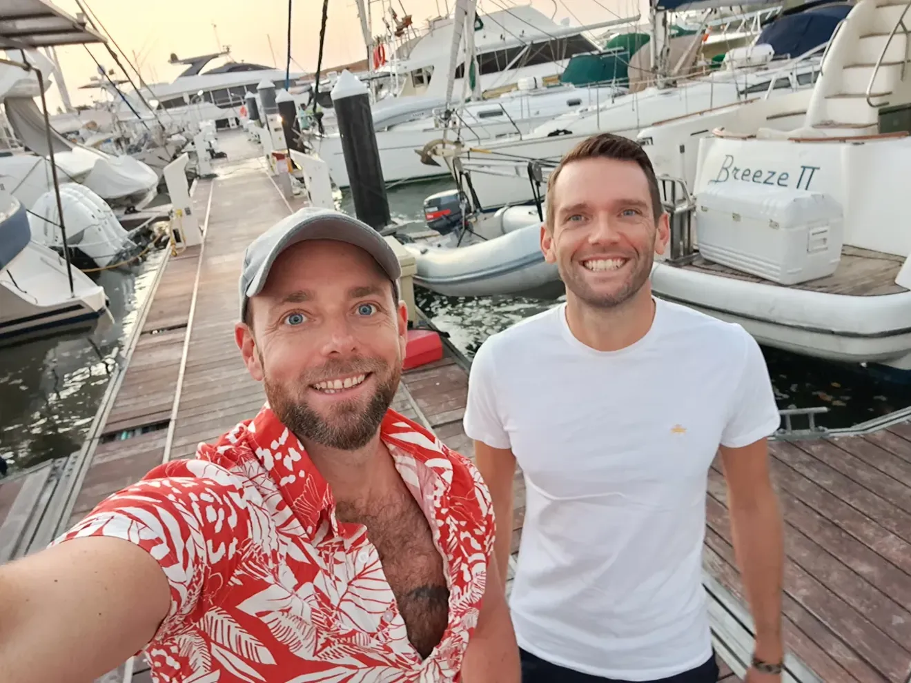 Tom and Peter posing for a photo on the dock